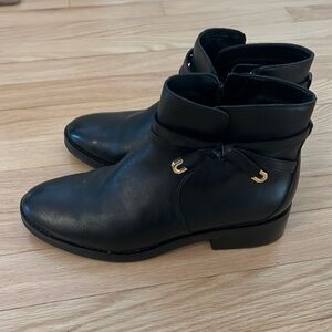 Cole Haan black boots with inside zipper and gold trim